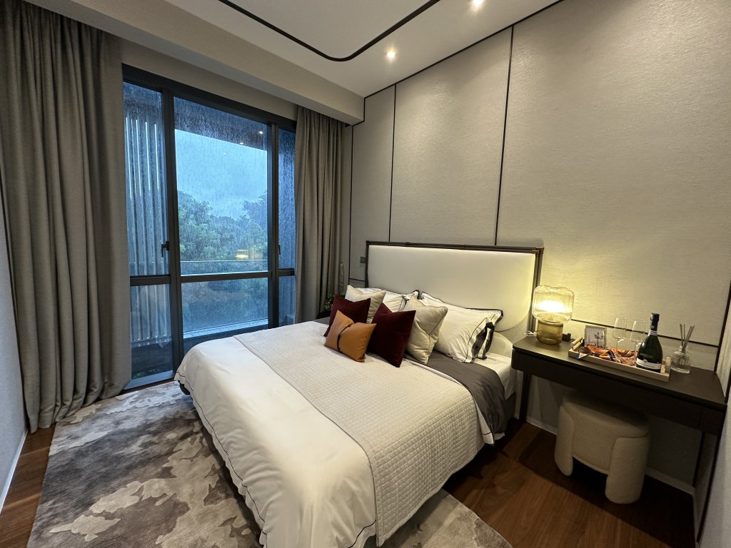 19 Nassim show suite bedroom with a garden view