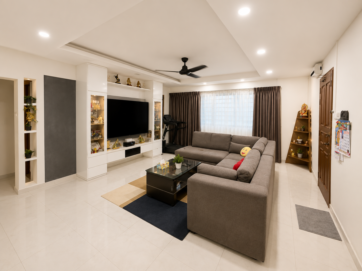 Renovated North-facing living and dining room at 413 Jurong West Street 42 with feature TV wall and false ceiling